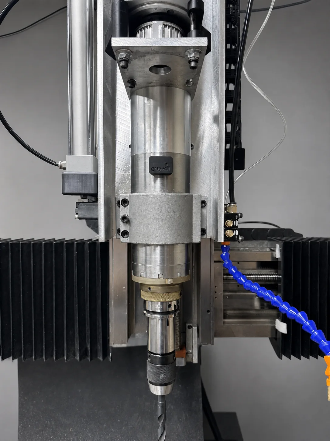 GrayVolt vibration analyzer mounted on a vertical CNC spindle