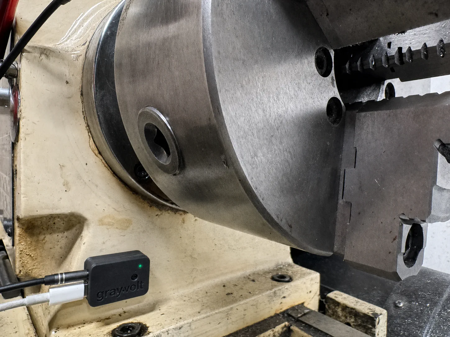 GrayVolt Vibration Analyzer beside the chuck of a JET lathe